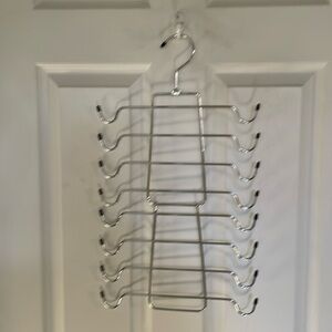 Metal multiple clothes hanger. Can hold eight items.